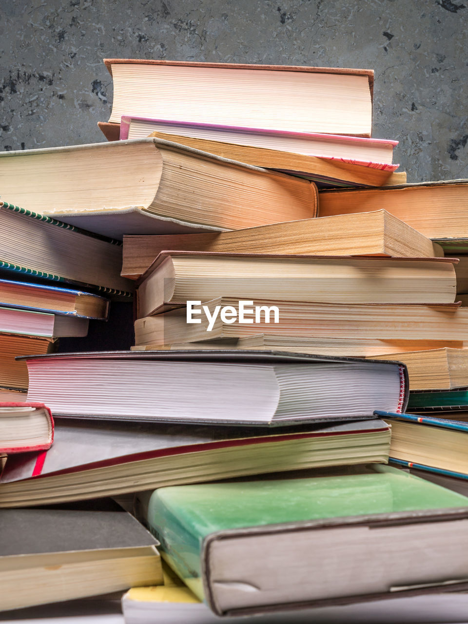 CLOSE-UP OF BOOKS ON BOOK