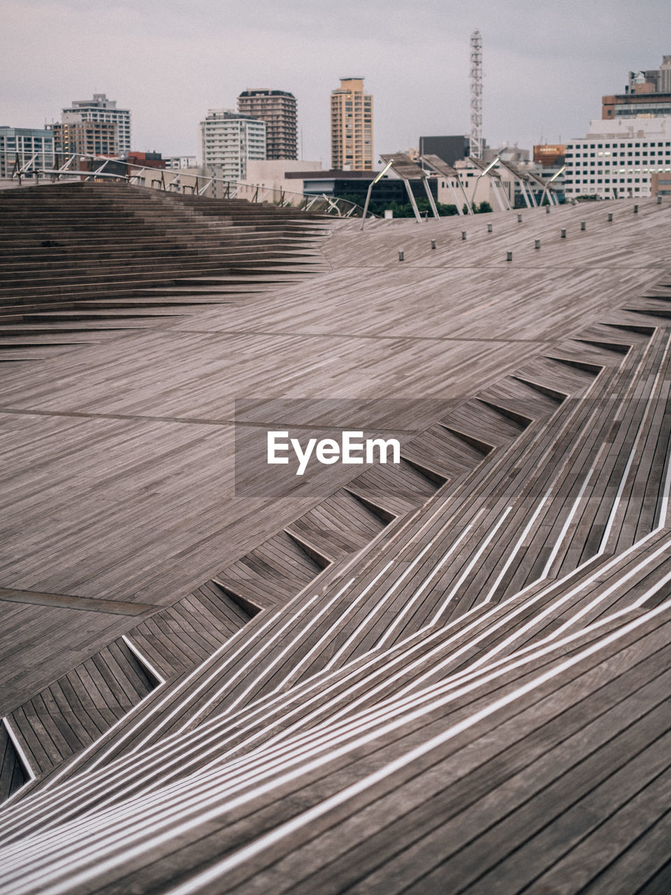 Tilt image of modern buildings against sky in city