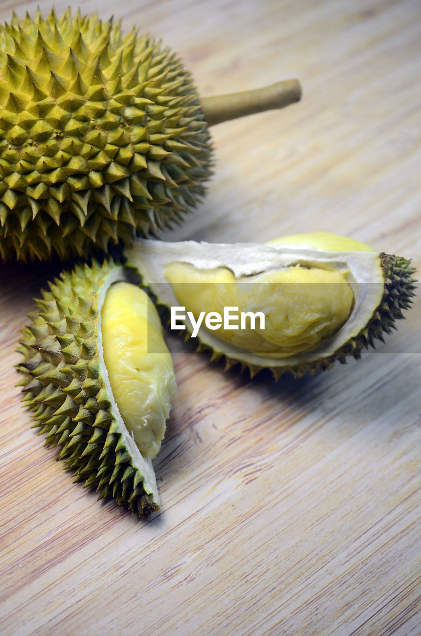 Close up opened durian fruits on wooden table background