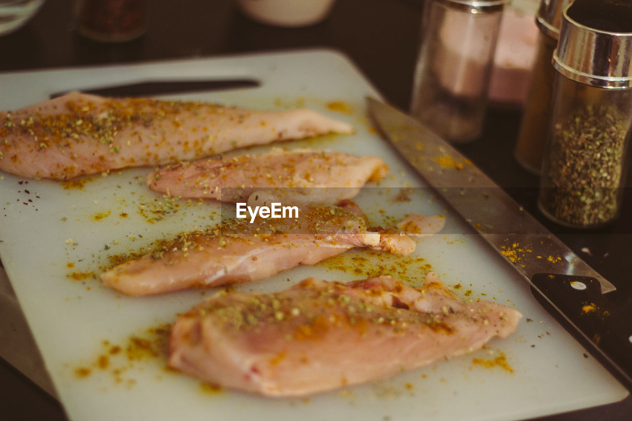 Chicken meat in tray on table