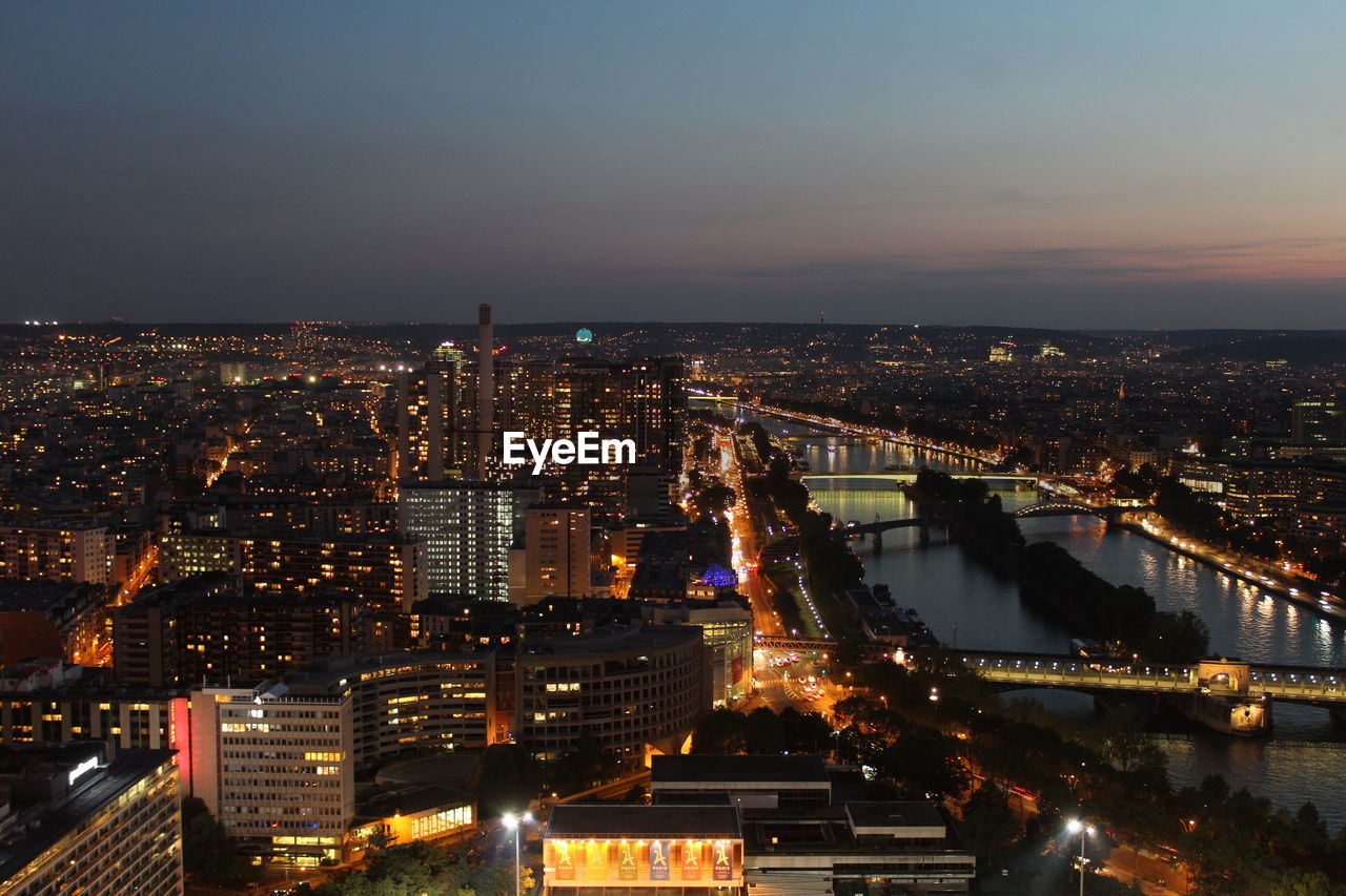 High angle view of city lit up at night