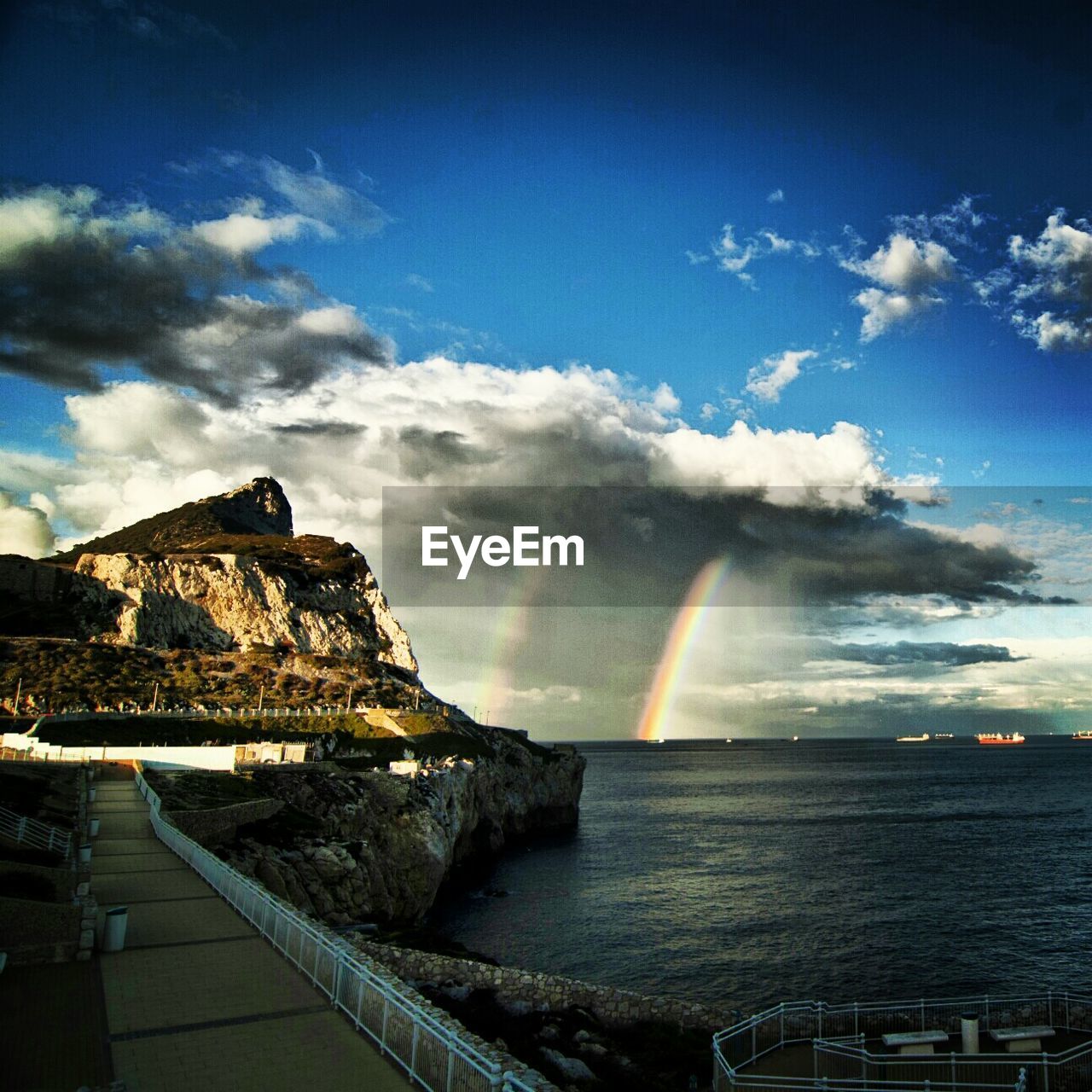 Beautiful view of rainbow against cloudy sky