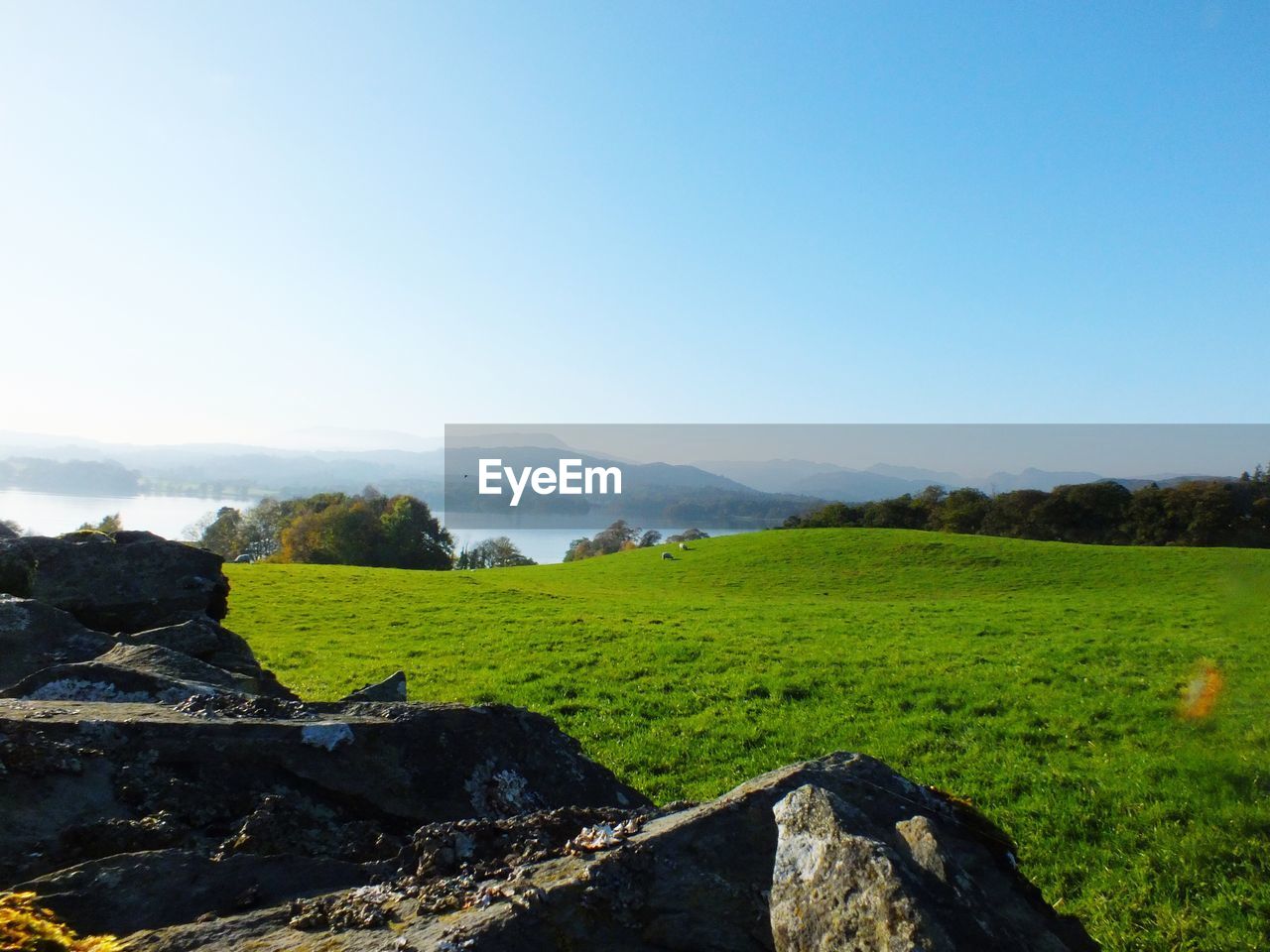 VIEW OF LANDSCAPE AGAINST BLUE SKY