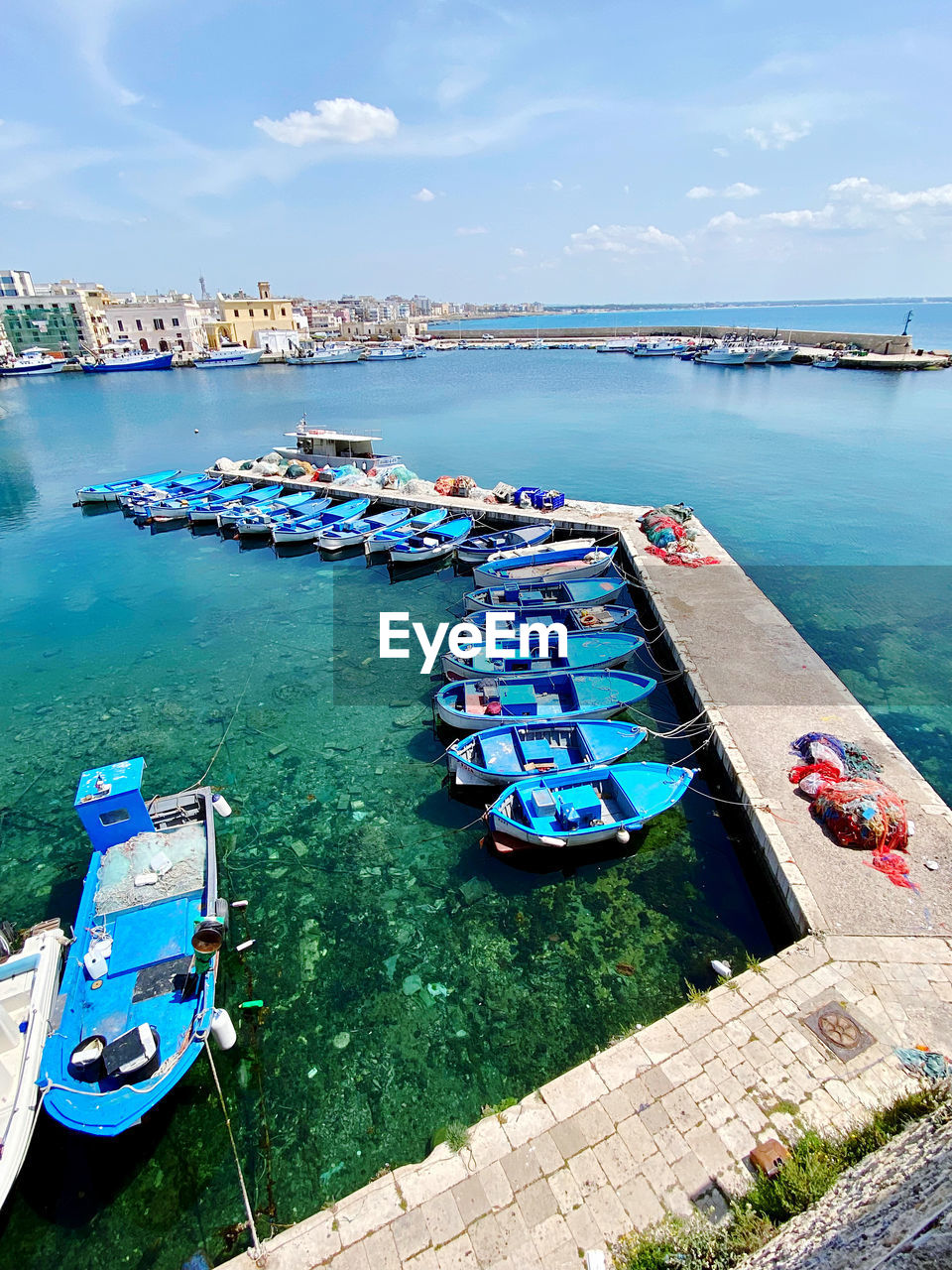 Fishing boats moored at harbor