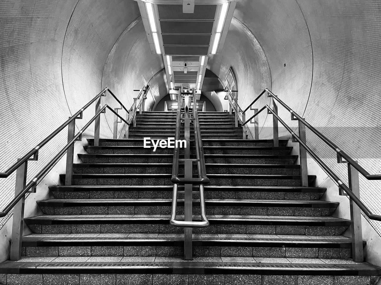 LOW ANGLE VIEW OF STEPS IN SUBWAY
