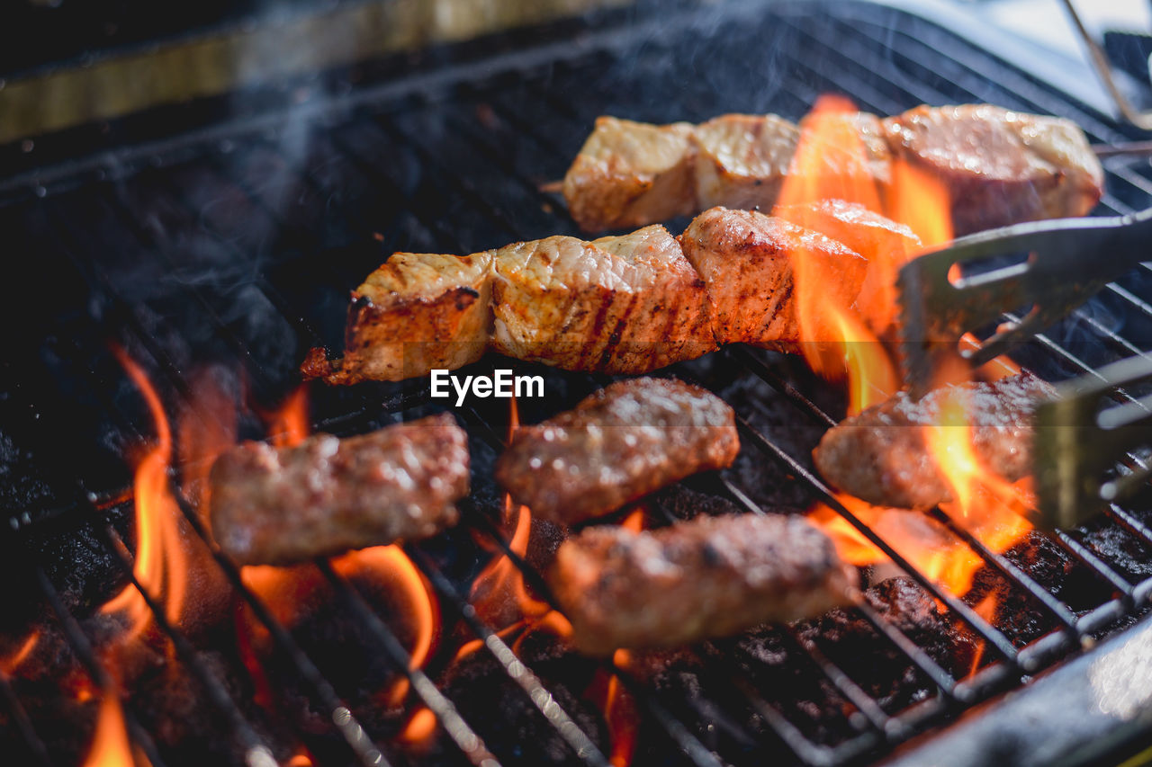 Close-up of meat cooking on barbecue grill