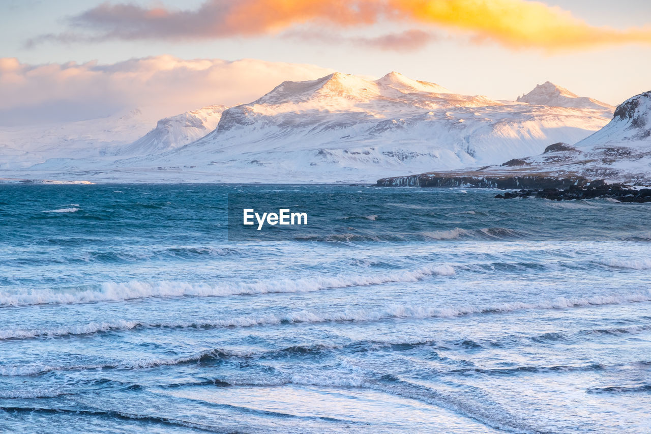 scenic view of mountains against sky during sunset