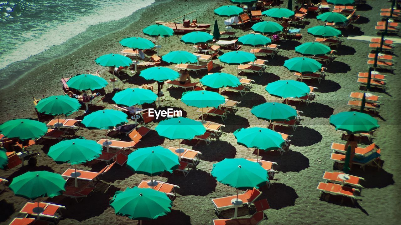 High angle view of parasols and lounge chairs on amalfi beach