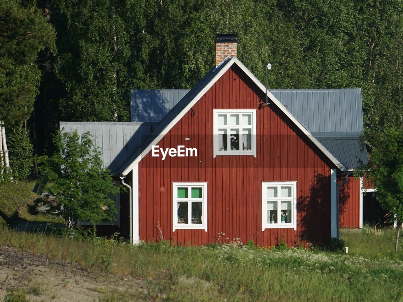 Red house on field