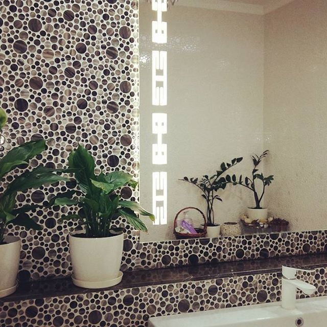 POTTED PLANTS ON WINDOW SILL AT HOME