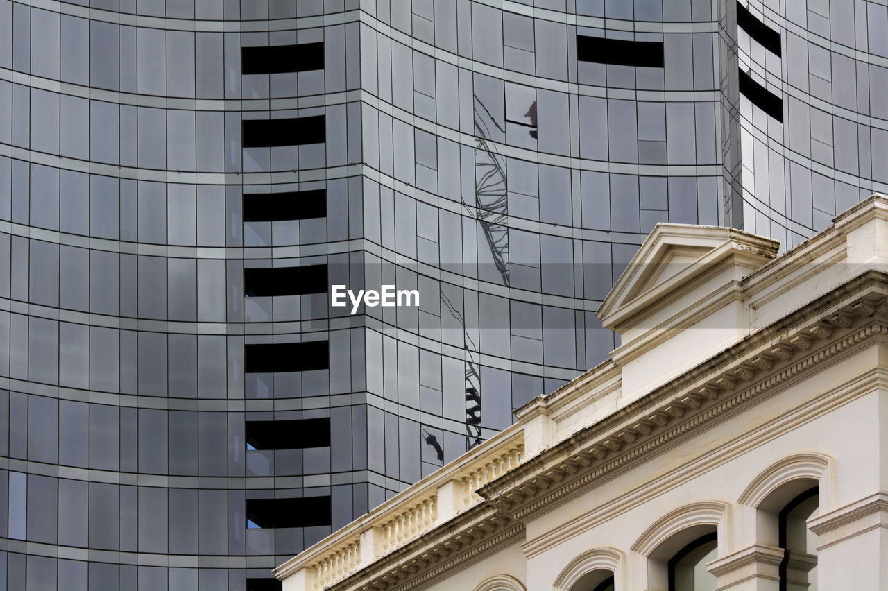 Low angle view of modern and historic building