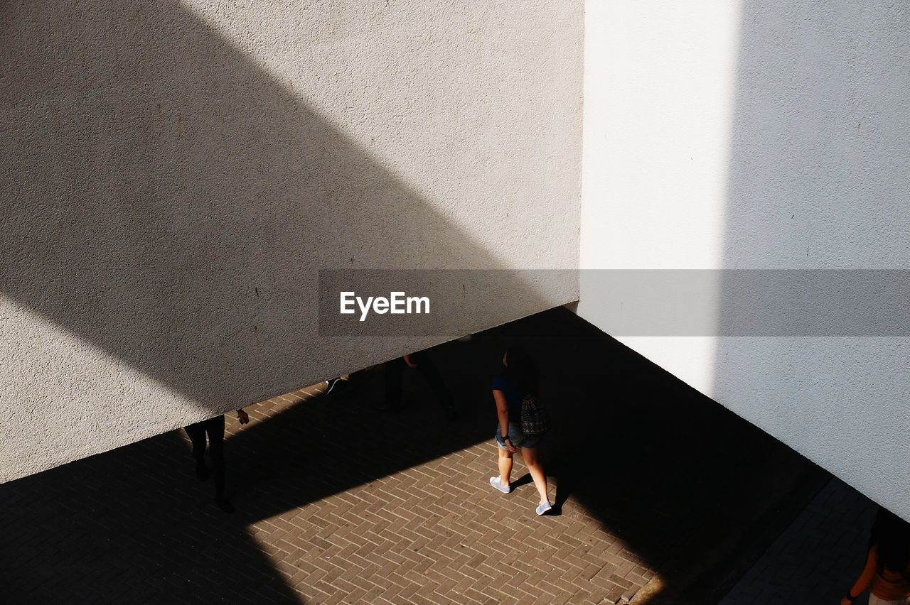 LOW SECTION OF MAN WALKING ON STREET