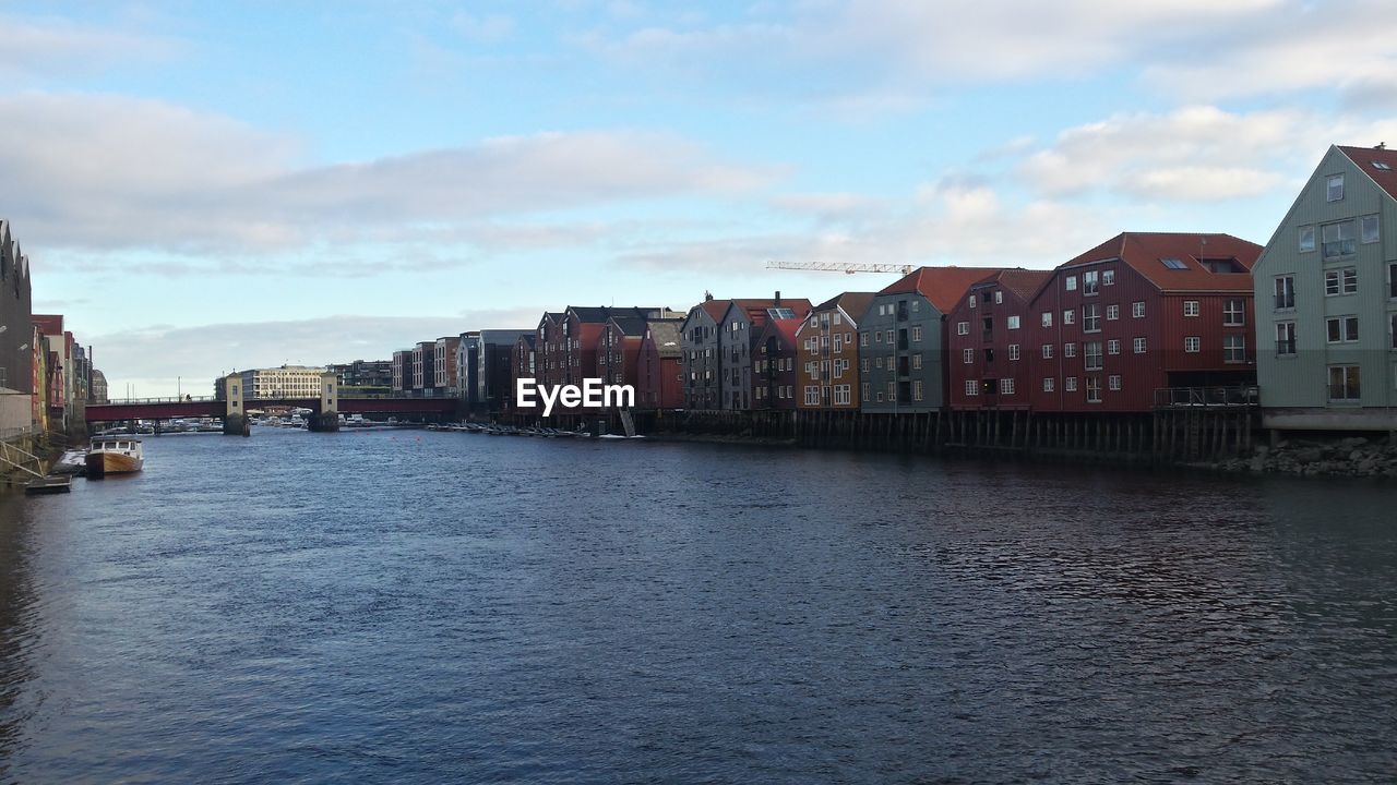 RIVER WITH BUILDINGS IN BACKGROUND