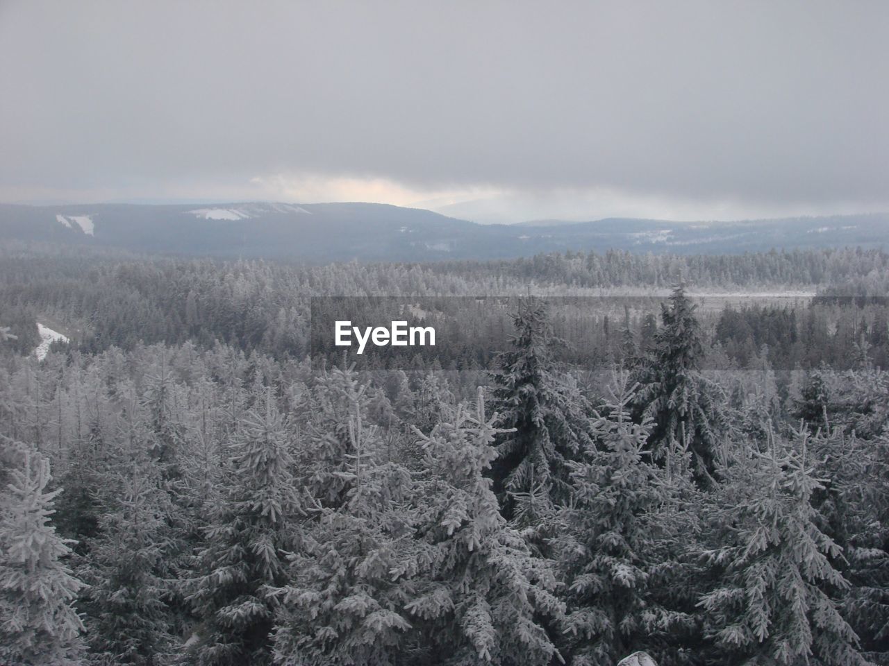 Scenic view of snow covered landscape against sky