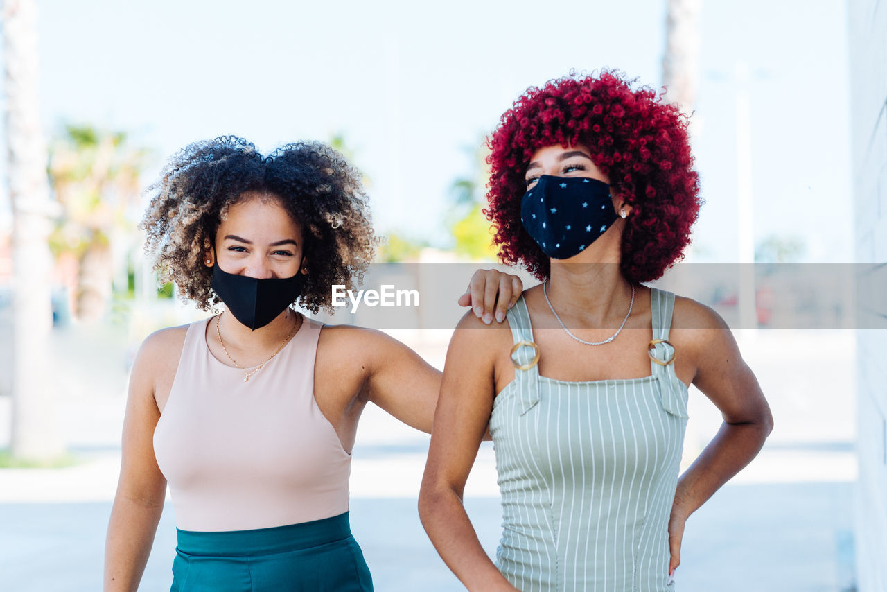 Two latin women with protection mask in a carefree attitude.