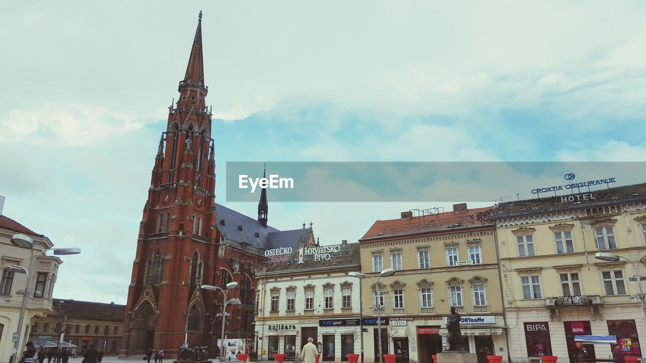 architecture, building exterior, built structure, sky, cloud - sky, day, history, religion, outdoors, place of worship, spirituality, travel destinations, city, no people