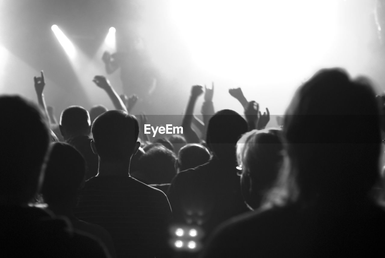 Group of people watching stage show