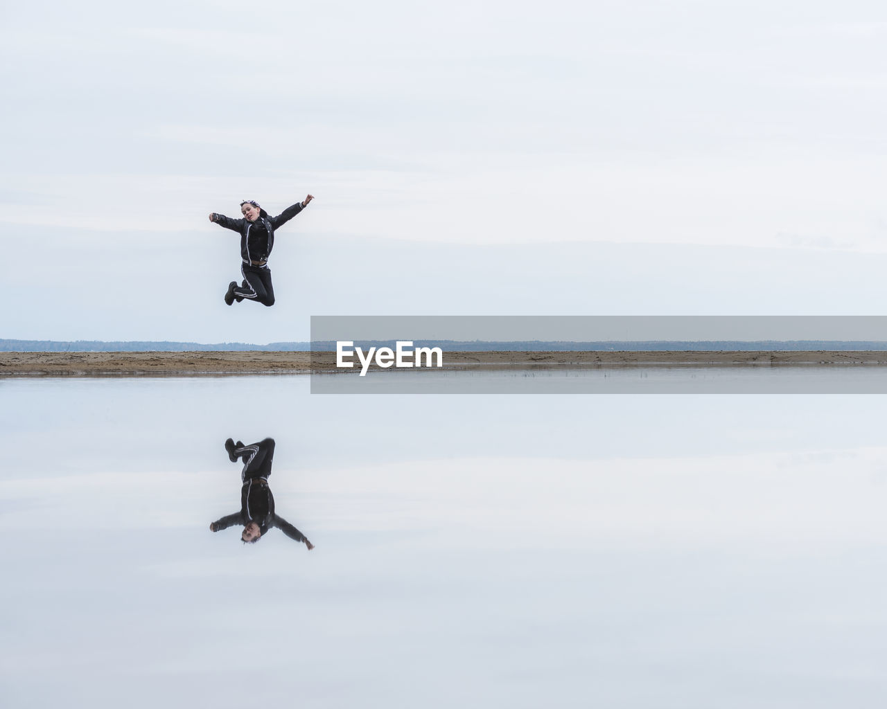 Man jumping at sea