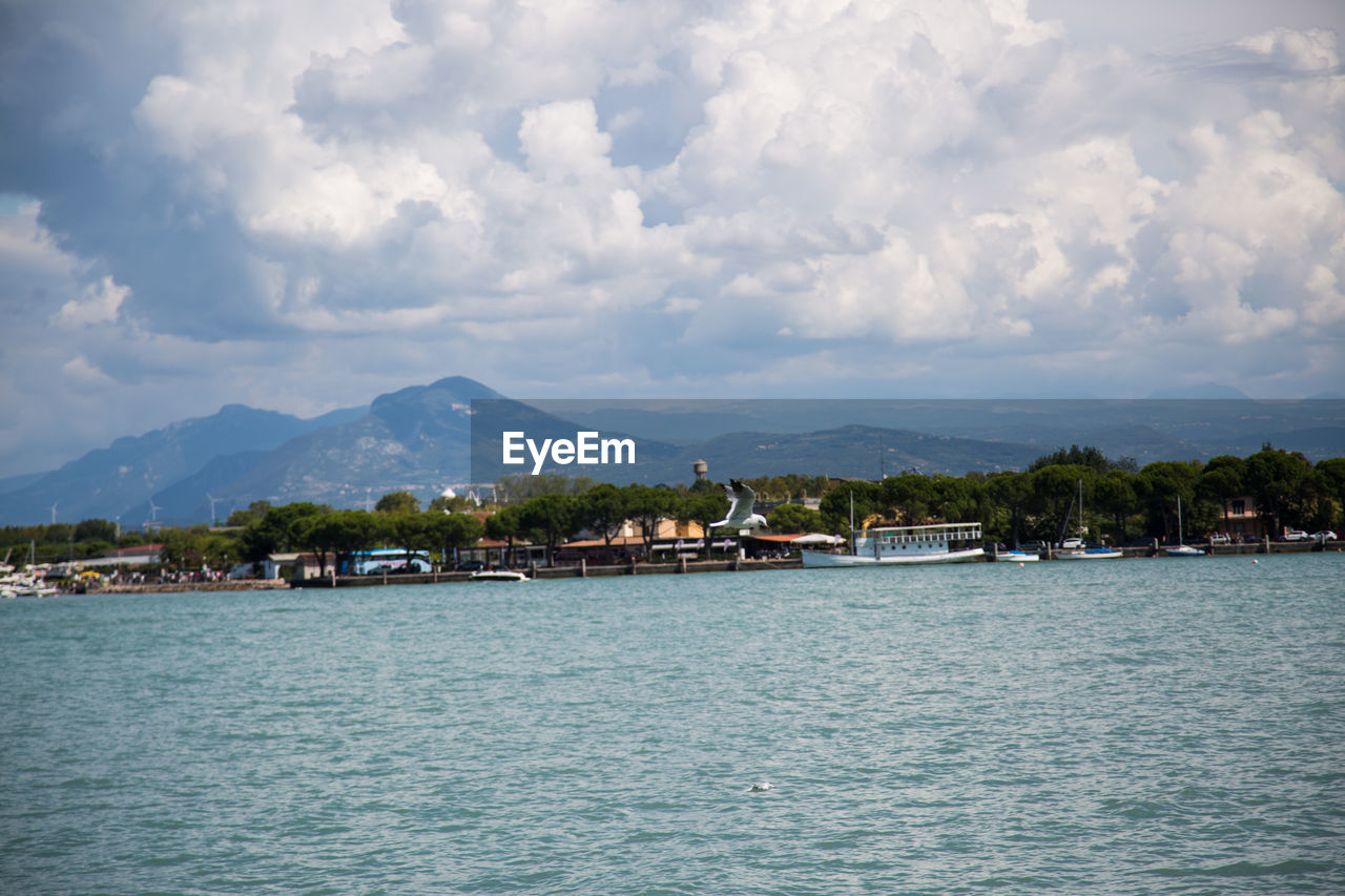 VIEW OF SEA AGAINST BUILDINGS