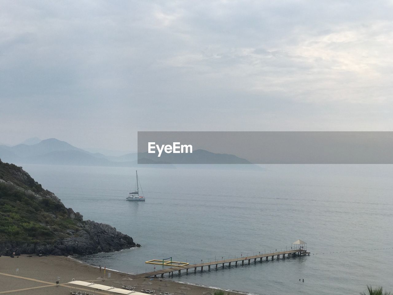 BOATS SAILING ON SEA AGAINST SKY