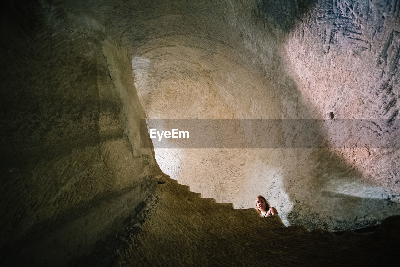 Low angle view of woman in cave