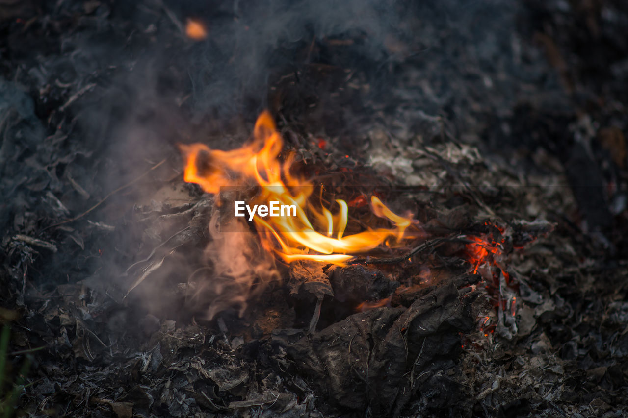 High angle view of fire burning on field