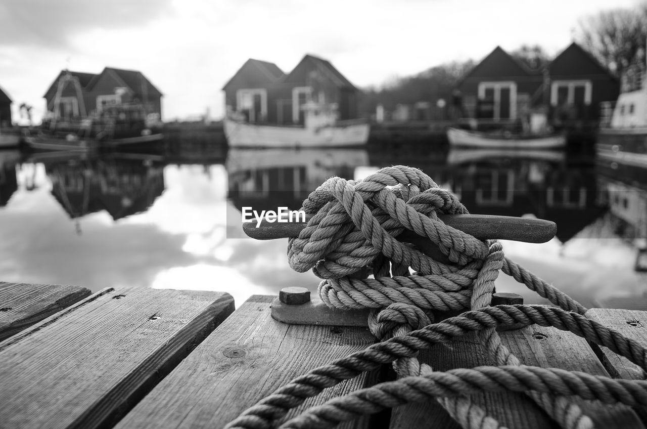 Close-up of rope tied on wooden post