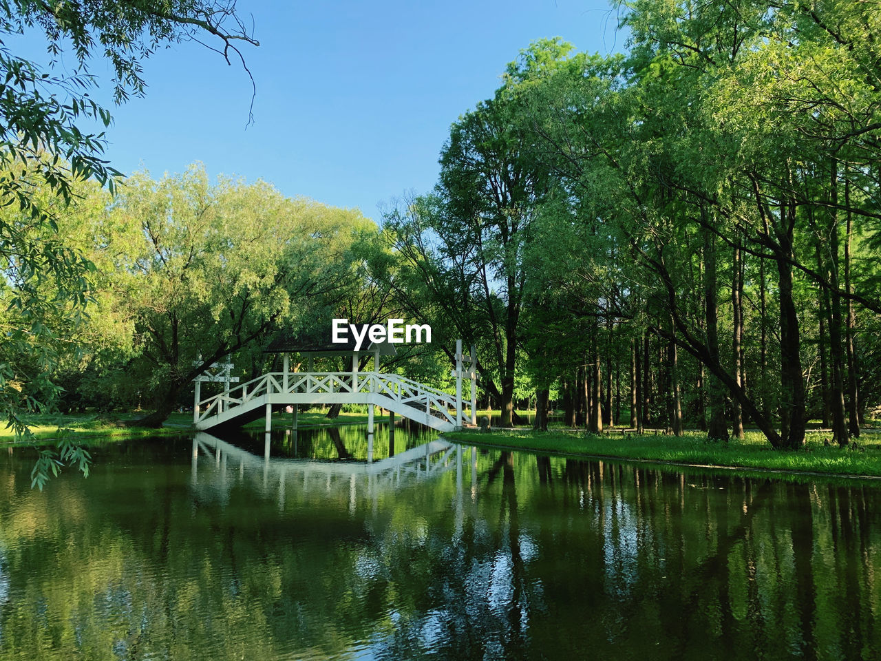 Bridge over lake against sky