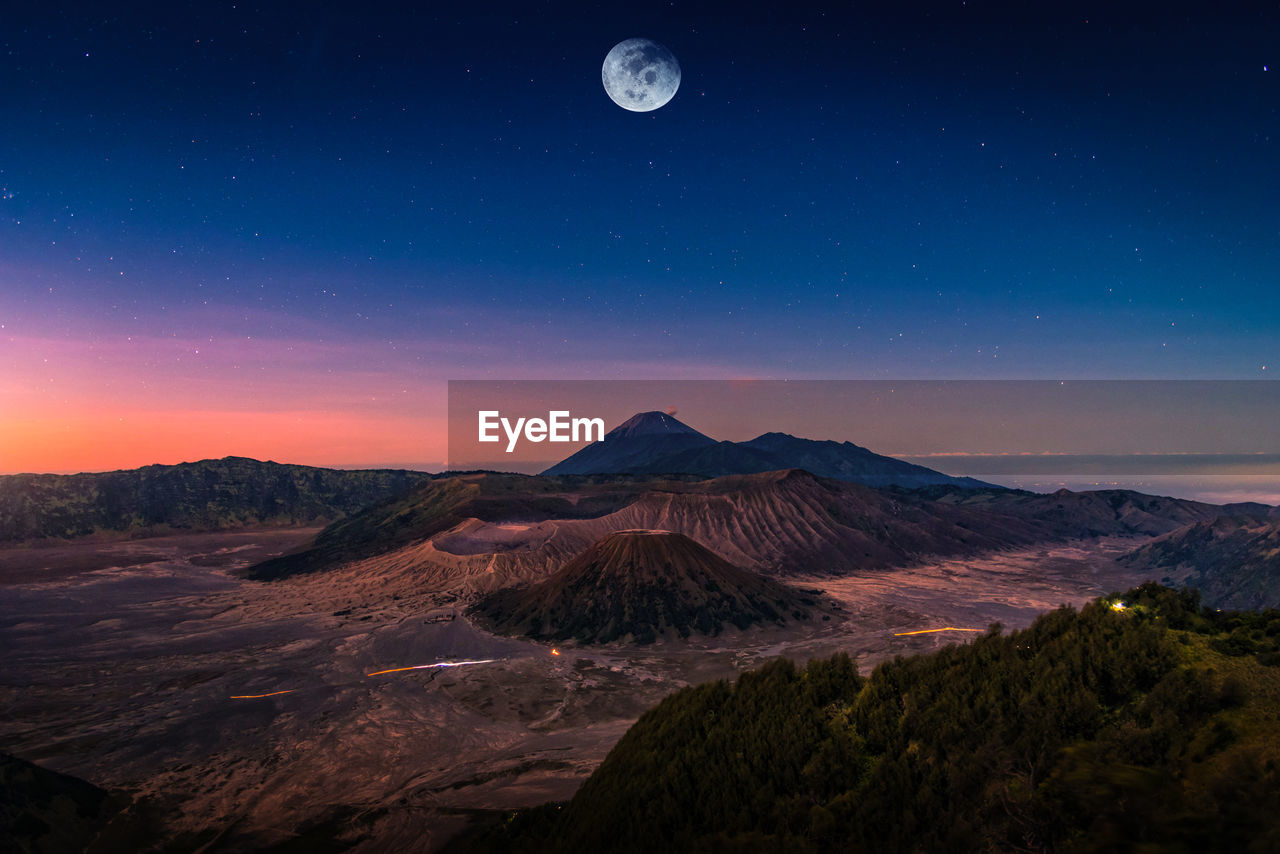 Scenic view of volcanic landscape against sky at night