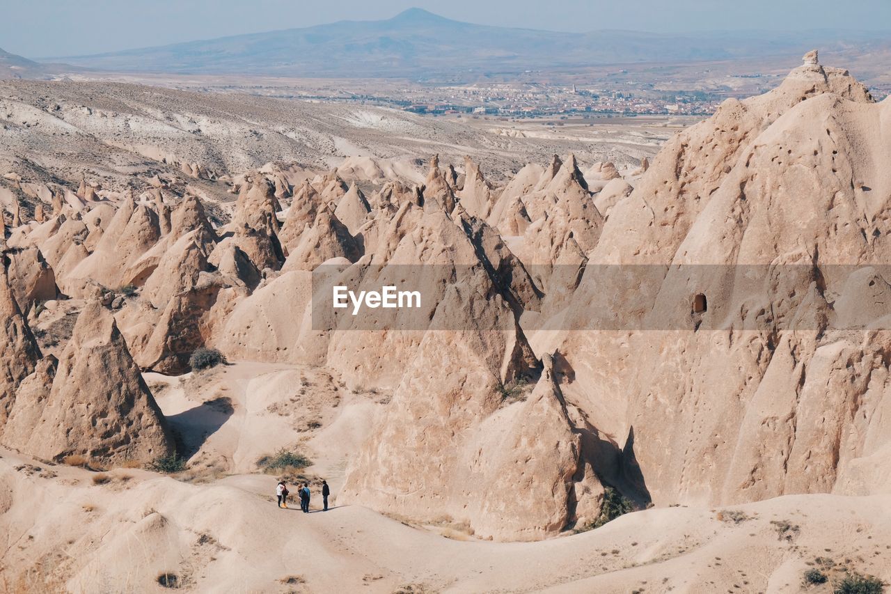 High angle view of tourists at badlands