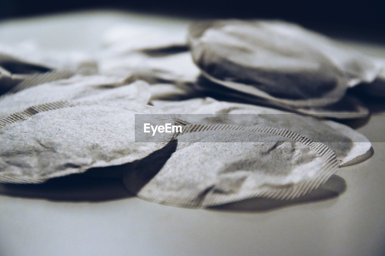 Close-up of teabags on table