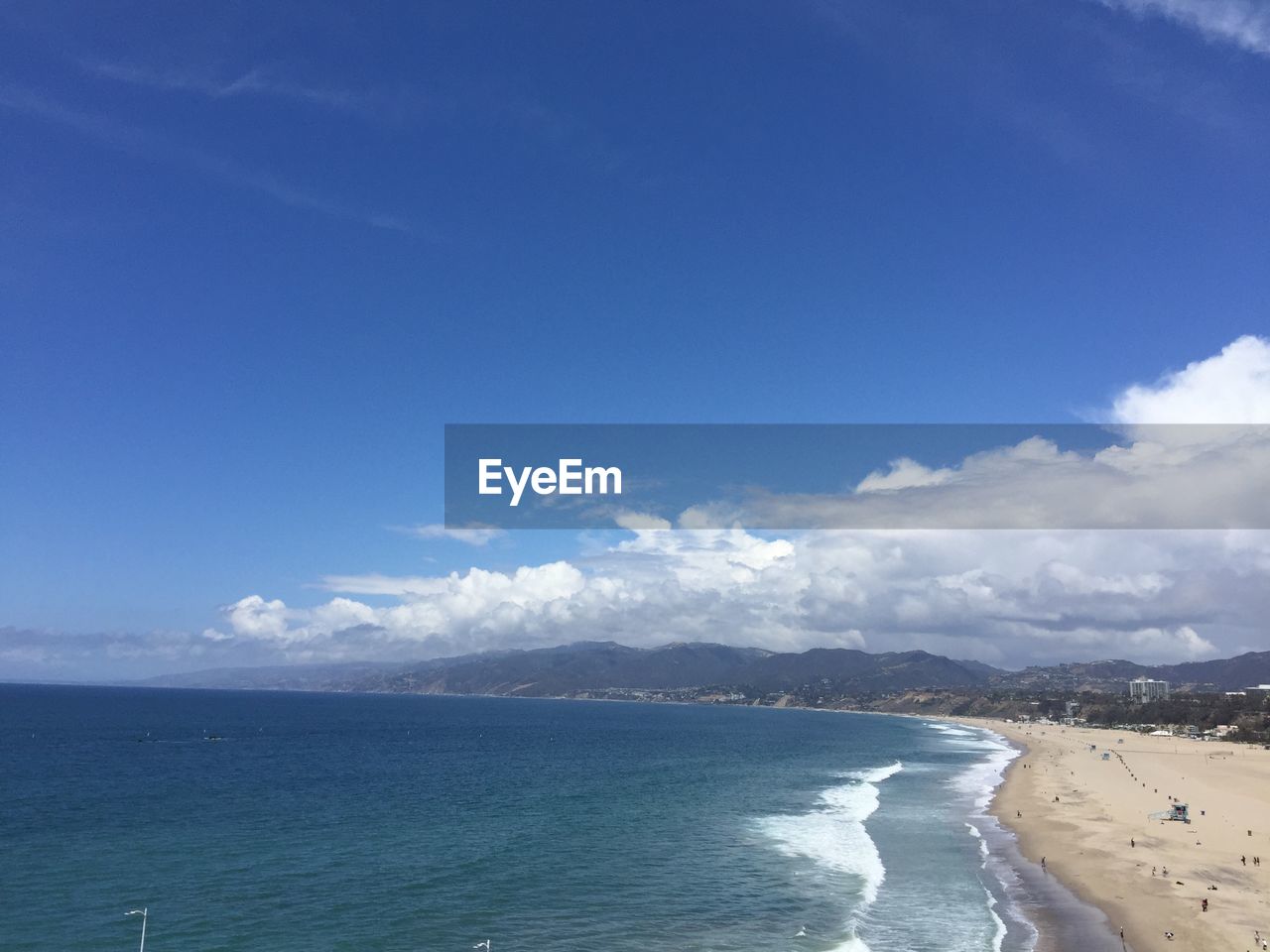 Scenic view of sea against blue sky