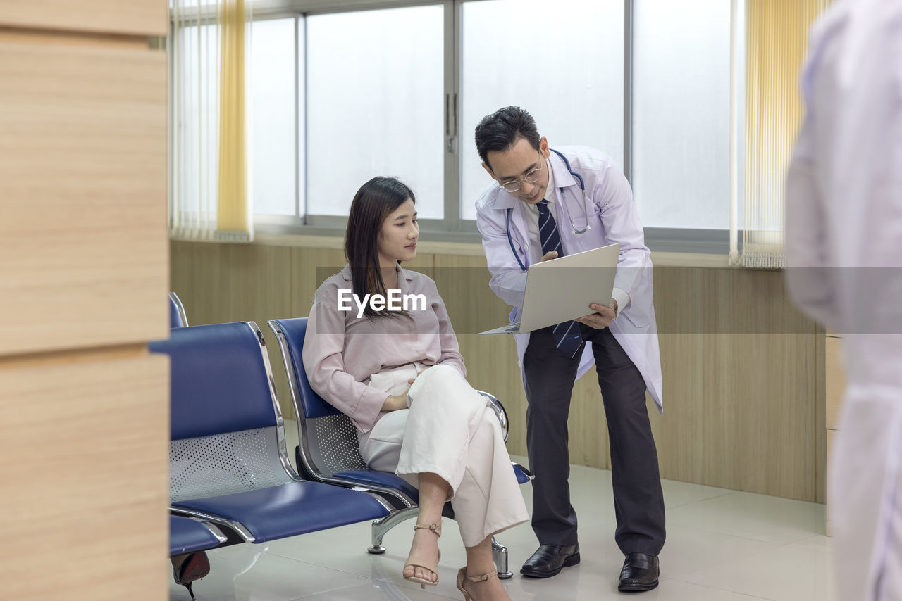 Asian doctors examine the patient's most previous scans