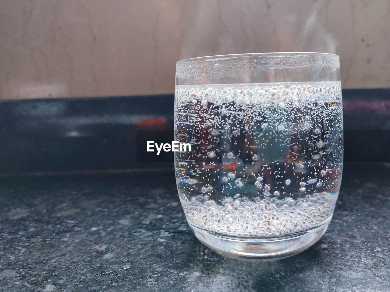 glass, drink, household equipment, food and drink, drinking glass, refreshment, water, indoors, table, no people, close-up, lighting, cold temperature, vase, focus on foreground, still life, drinkware, nature, bubble, wet