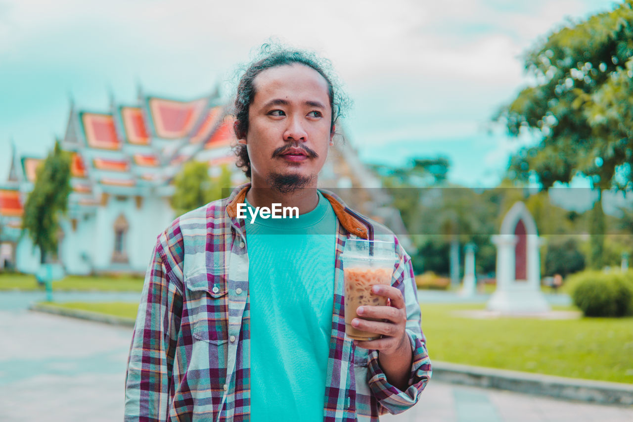 Portrait of young woman using mobile phone