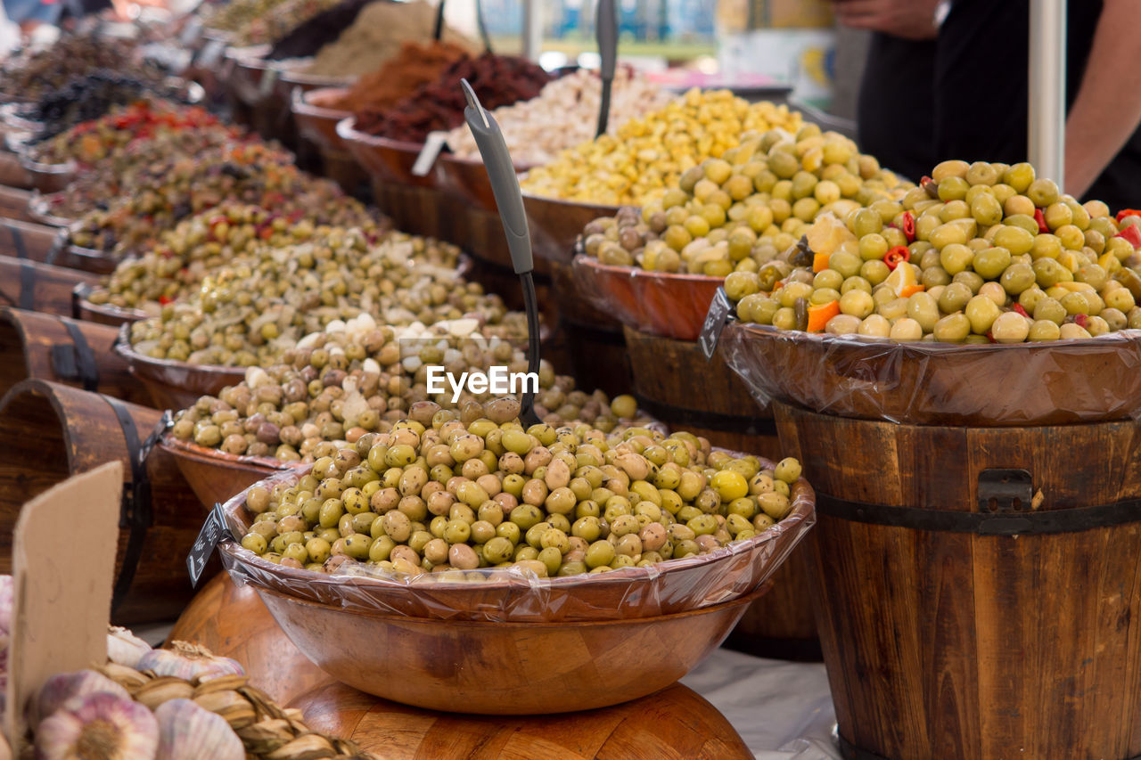 Close-up of various olives for sale at market stall