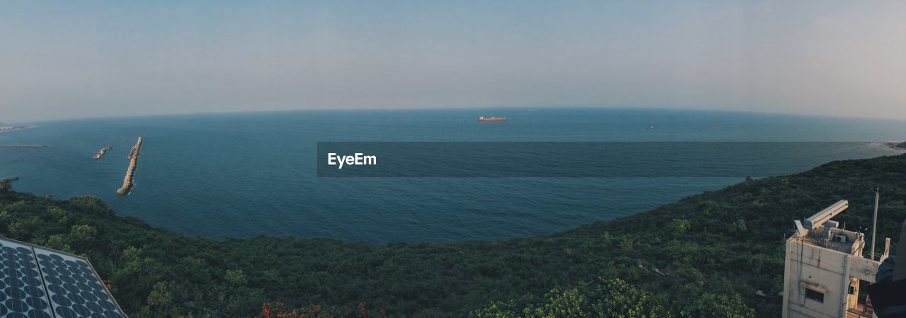 HIGH ANGLE VIEW OF SEA AND MOUNTAIN AGAINST SKY