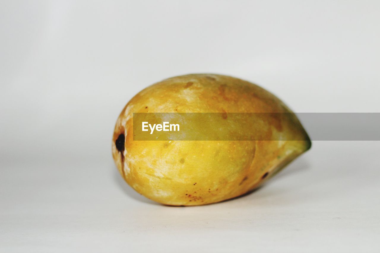 food, food and drink, produce, healthy eating, fruit, studio shot, plant, wellbeing, freshness, yellow, vegetable, single object, indoors, no people, close-up, white background, cut out, citrus, raw potato, raw food, still life