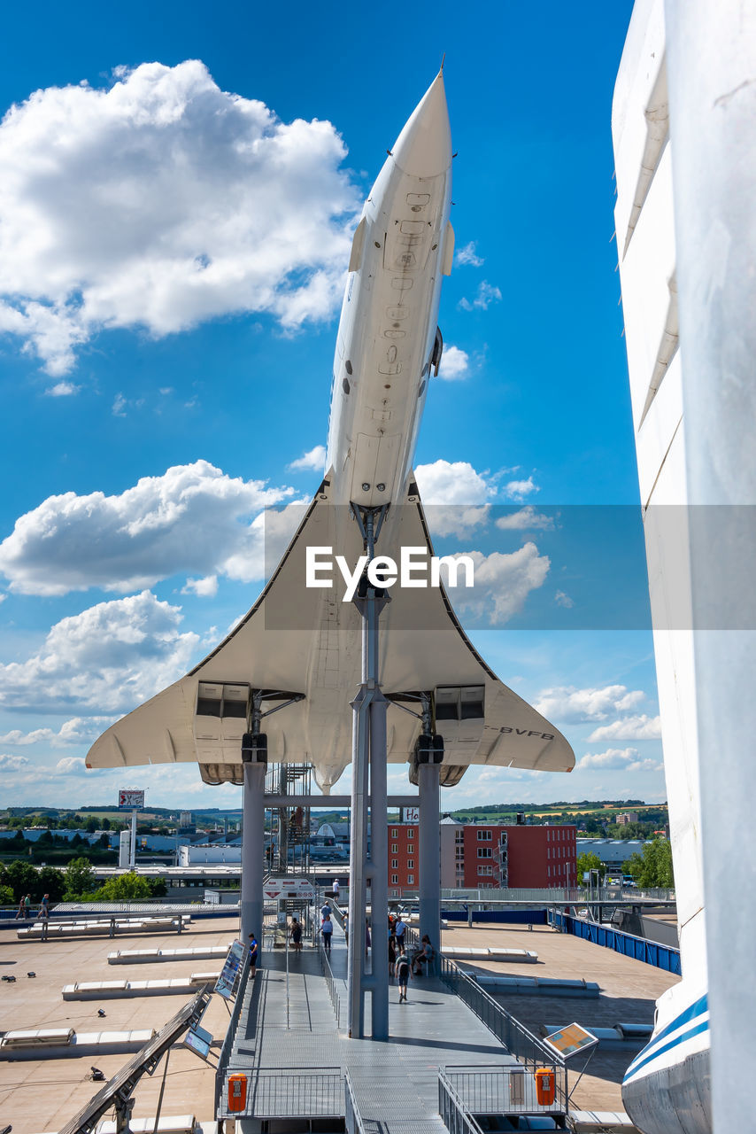 sky, cloud, transportation, architecture, nature, mode of transportation, vehicle, airplane, day, no people, air vehicle, travel, blue, aircraft, outdoors, built structure, aviation, travel destinations, business finance and industry