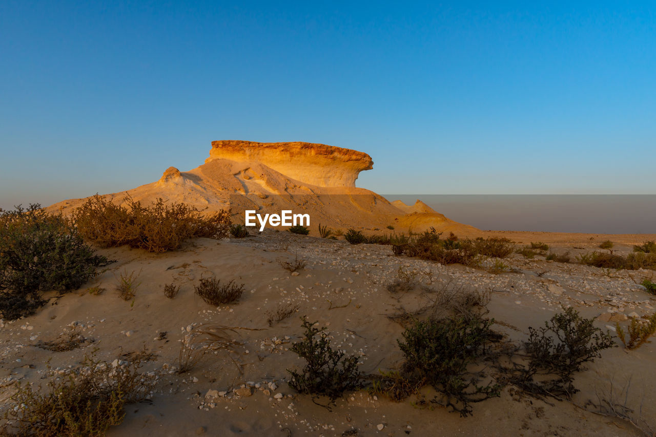 scenic view of mountains against clear blue sky