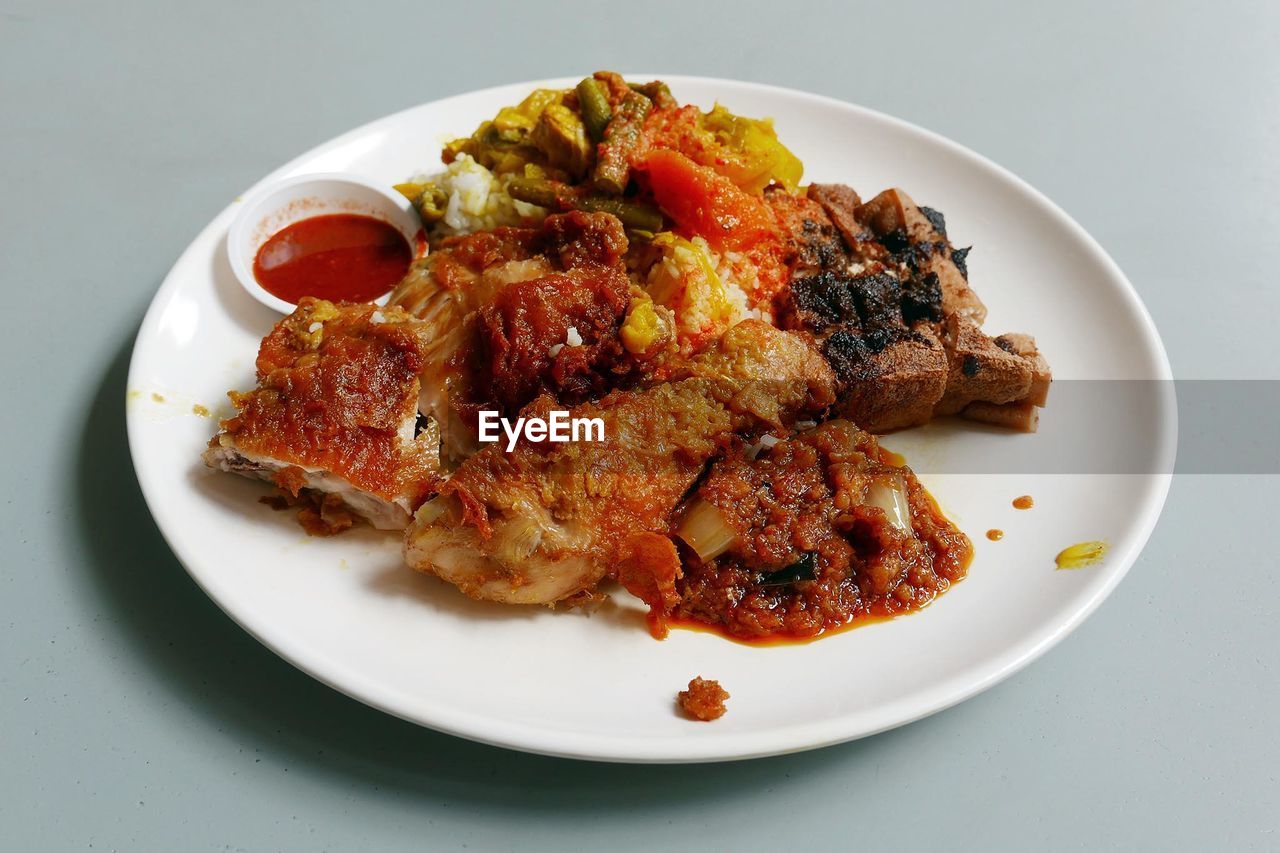 Close-up of fried chicken in plate on table