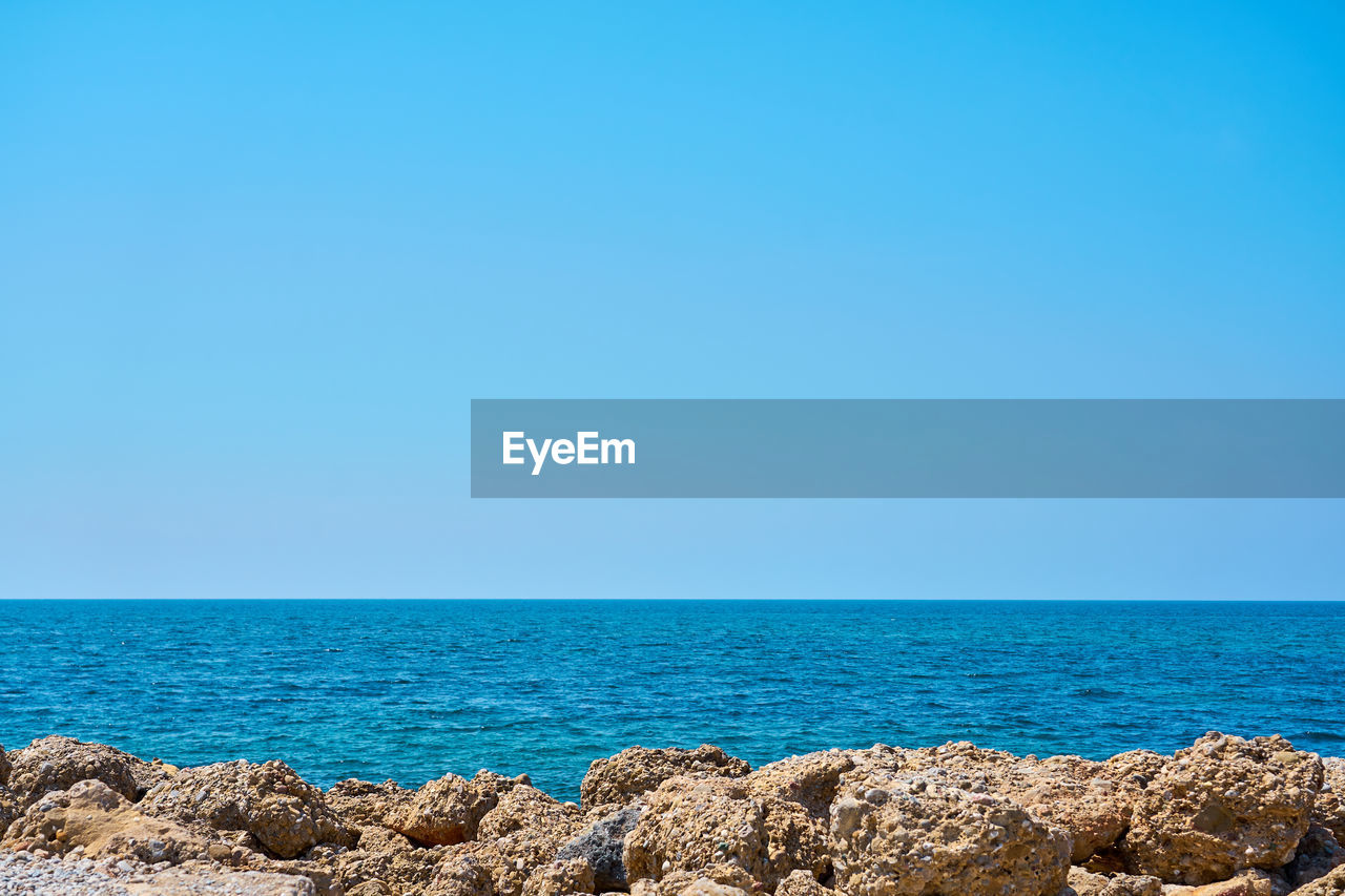 SCENIC VIEW OF SEA AGAINST BLUE SKY