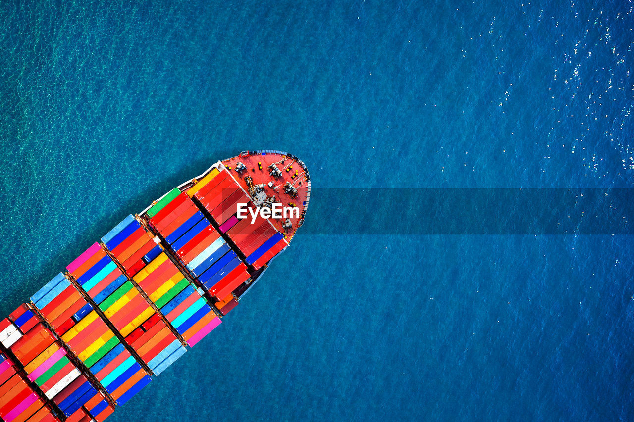 Aerial view of container ship in sea