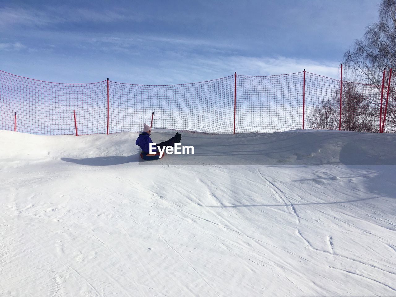 MAN WITH UMBRELLA ON SNOW