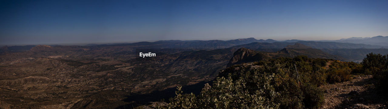 SCENIC VIEW OF MOUNTAIN RANGE AGAINST SKY