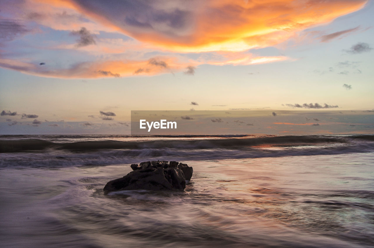 SCENIC VIEW OF SEA DURING SUNSET