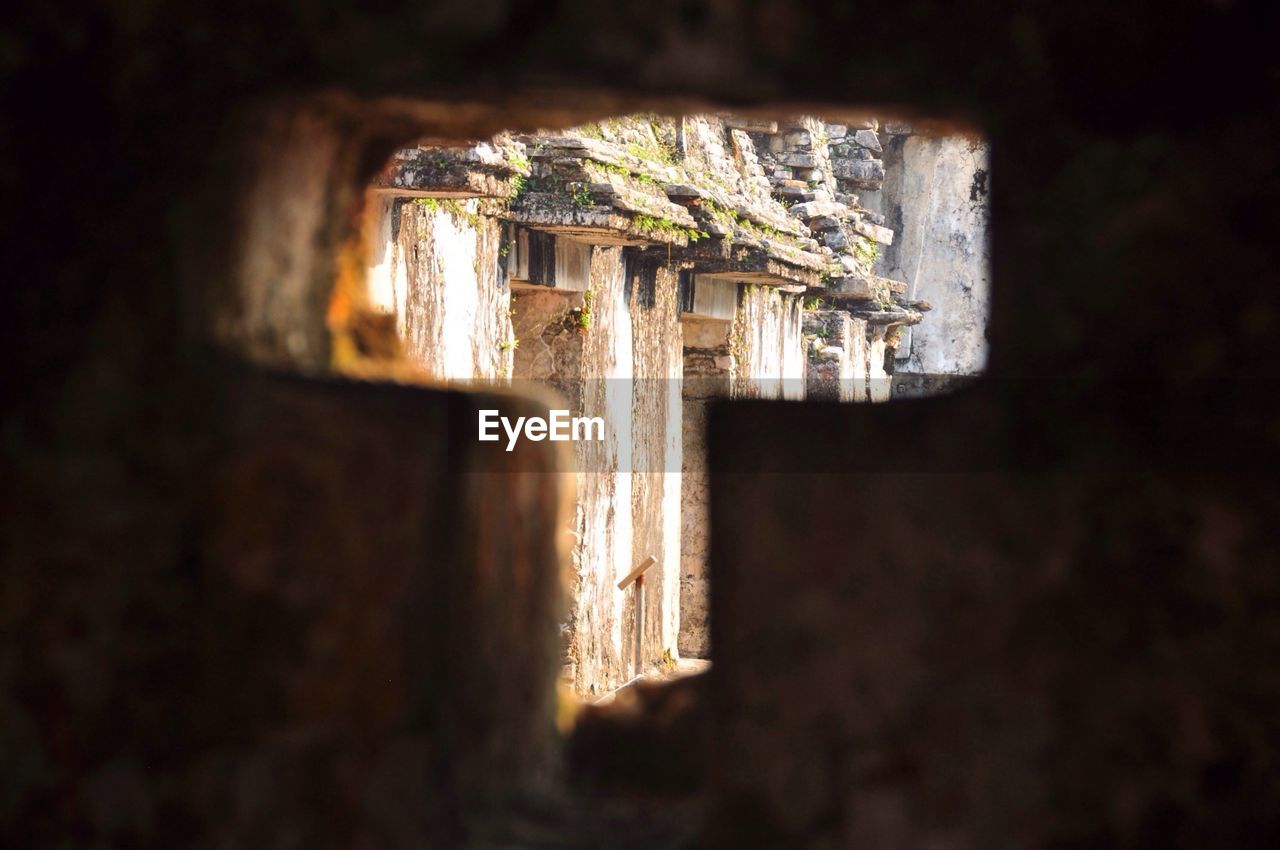 Historical building seen through t-shaped window