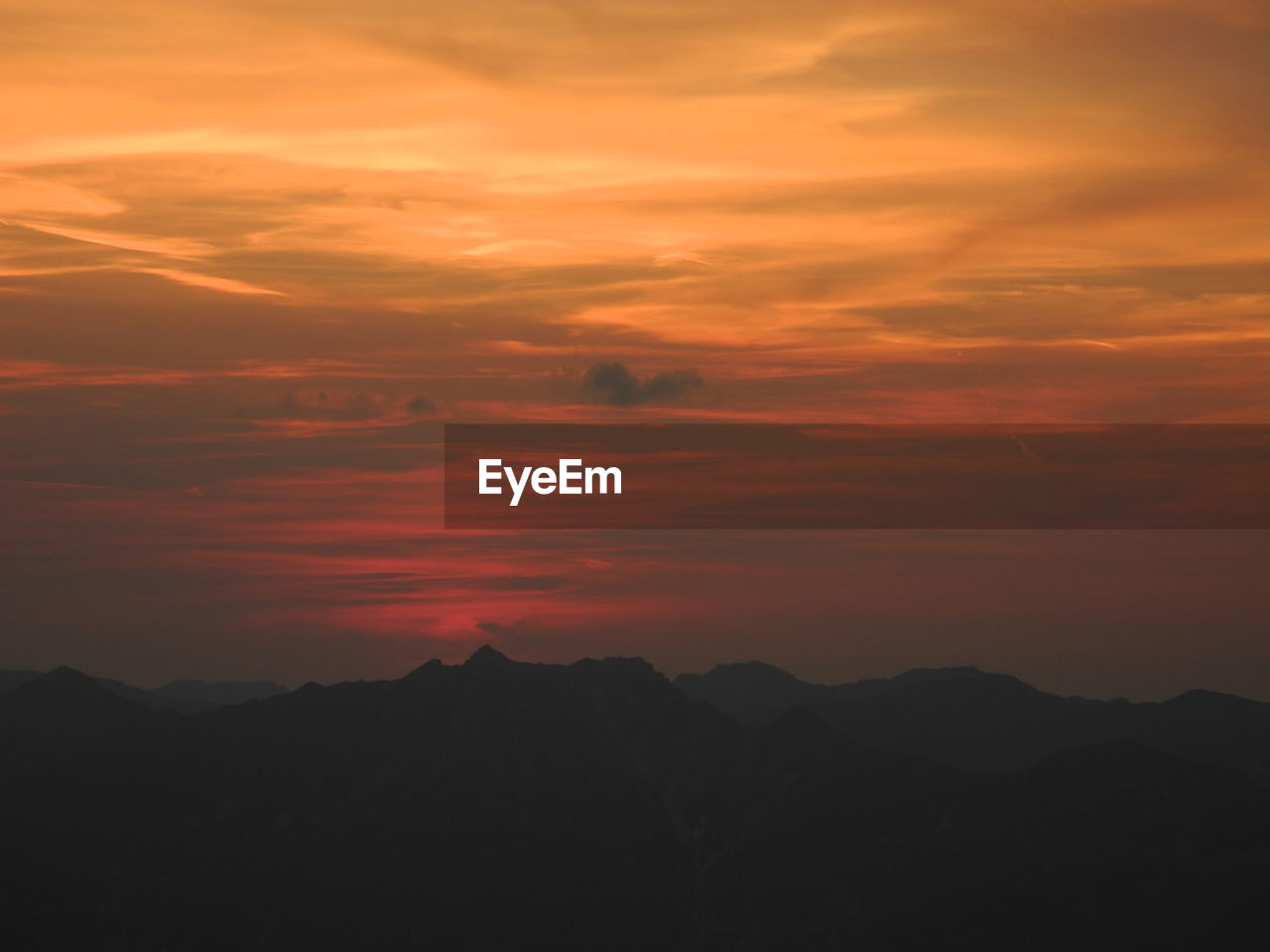 Scenic view of dramatic sky during sunset