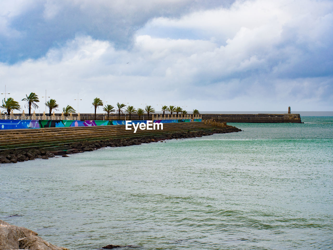 PANORAMIC VIEW OF BEACH AGAINST SKY