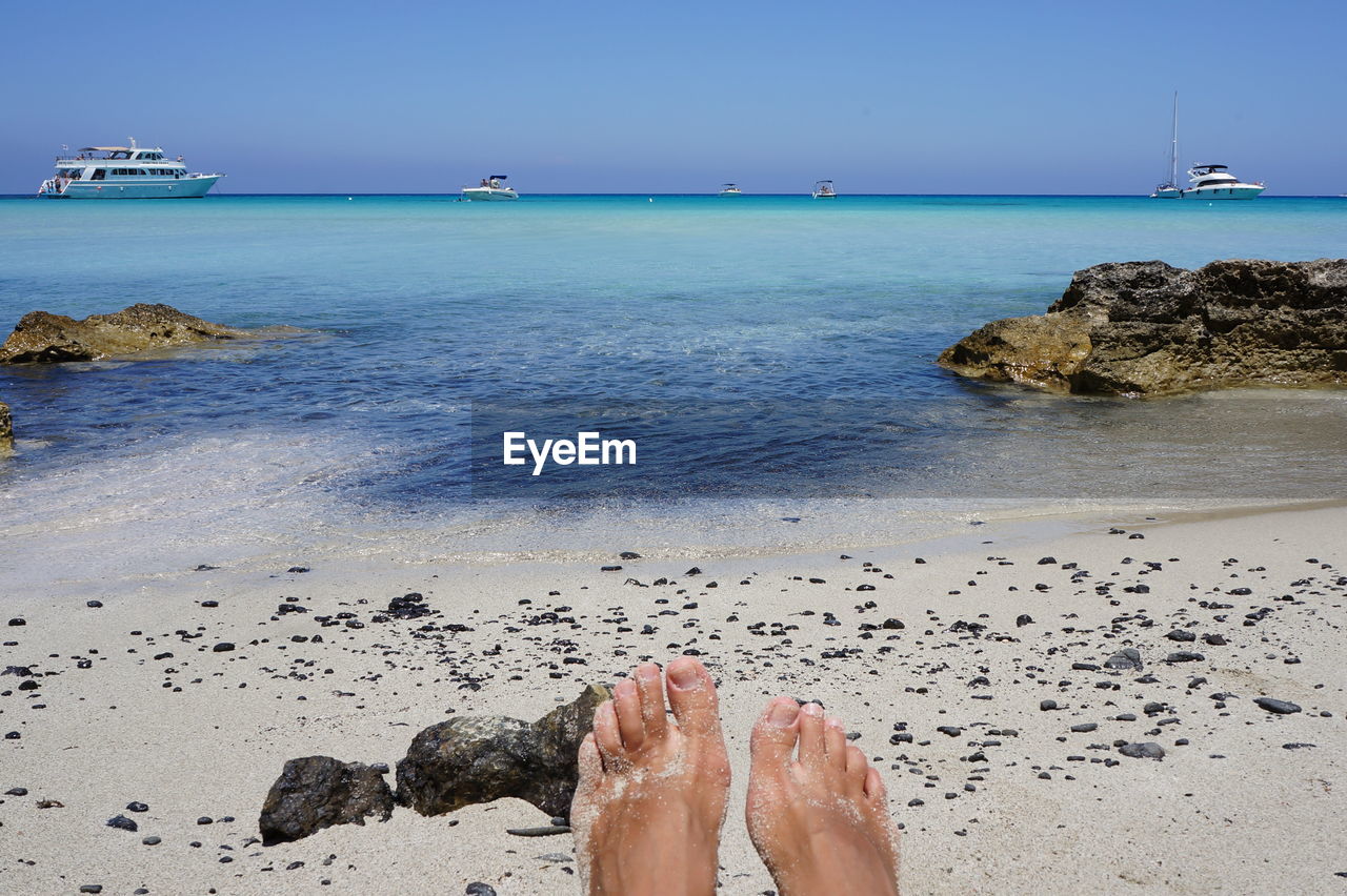 Man's foot on beach